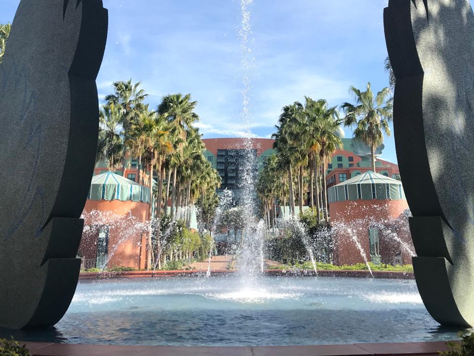view of the swan and dolphin resort from under and outdoor water sculpture