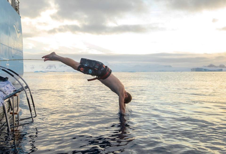 Damien Riddle dives from a cruise ship on his Antarctica trip in October.