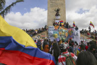 Demonstrators march during an anti-government protest in Bogota, Colombia, Wednesday, May 12, 2021. Colombians have taken to the streets for weeks across the country after the government proposed tax increases on public services, fuel, wages and pensions, but have continued even after President Ivan Duque walked back the tax hike. (AP Photo/Ivan Valencia)