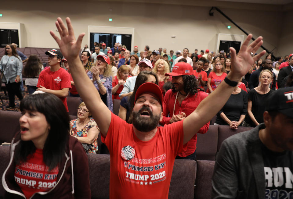 Joel Perez, wearing a red Evangelicals for Trump T-shirt, a campaign event.