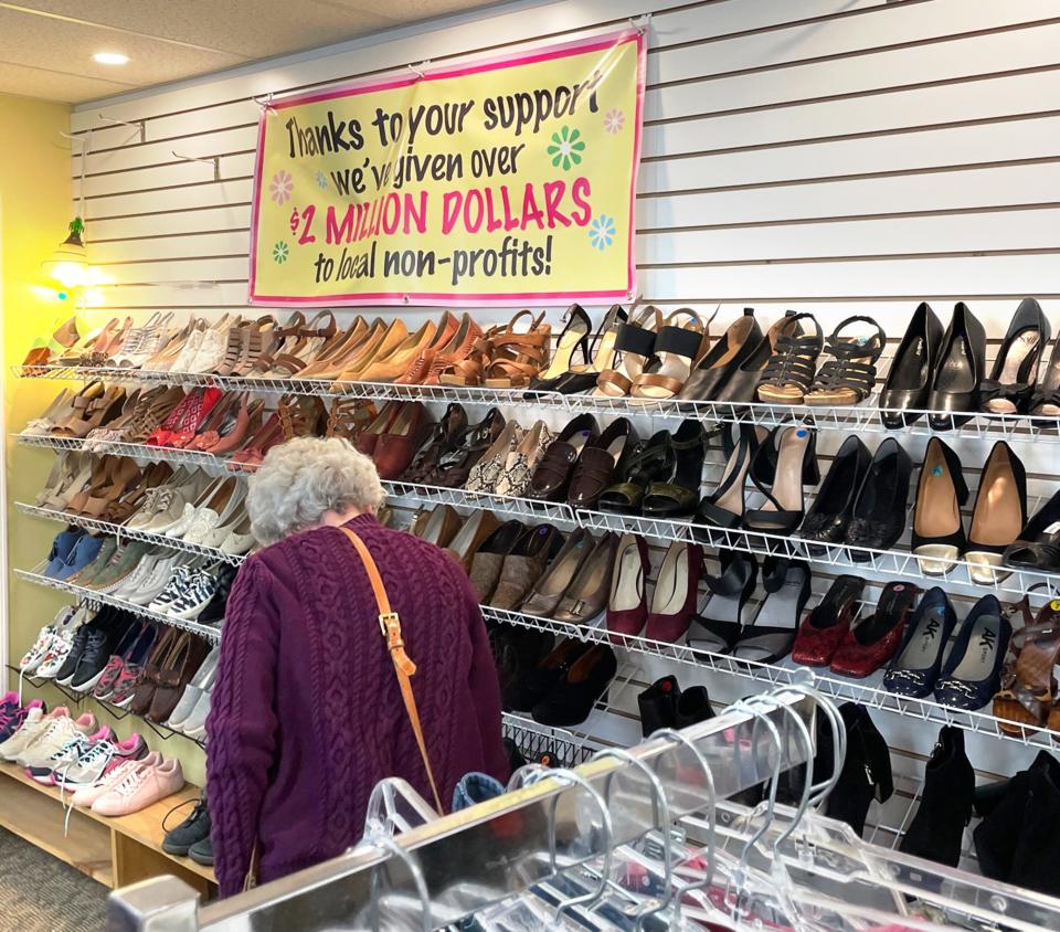 A woman searches for shoes at the Fabulous Find in Kittery where the nonprofit has given over $2 million to area non-profit organizations.