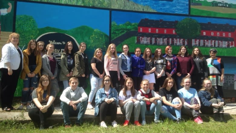 Students spruce up historic Red Brick Row houses in Sydney Mines