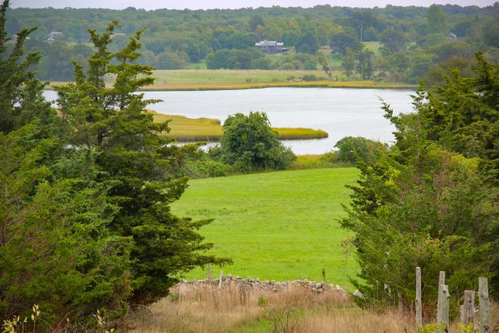 A field at Westport Town Farm overlooks the East Branch of the Westport River.