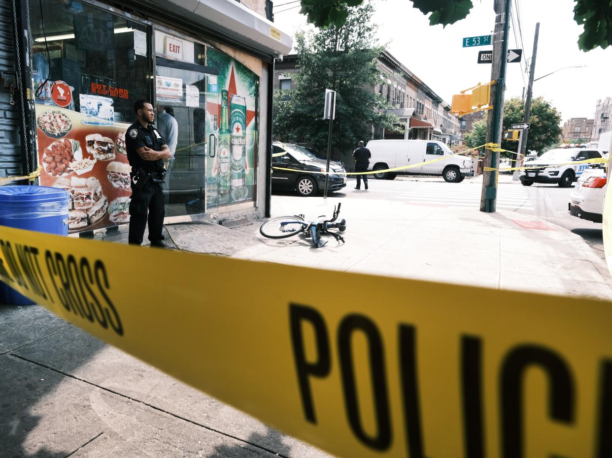 Police converge on the scene of a shooting in Brooklyn, one of numerous during the day, on July 14, 2021 in New York City (Getty Images)