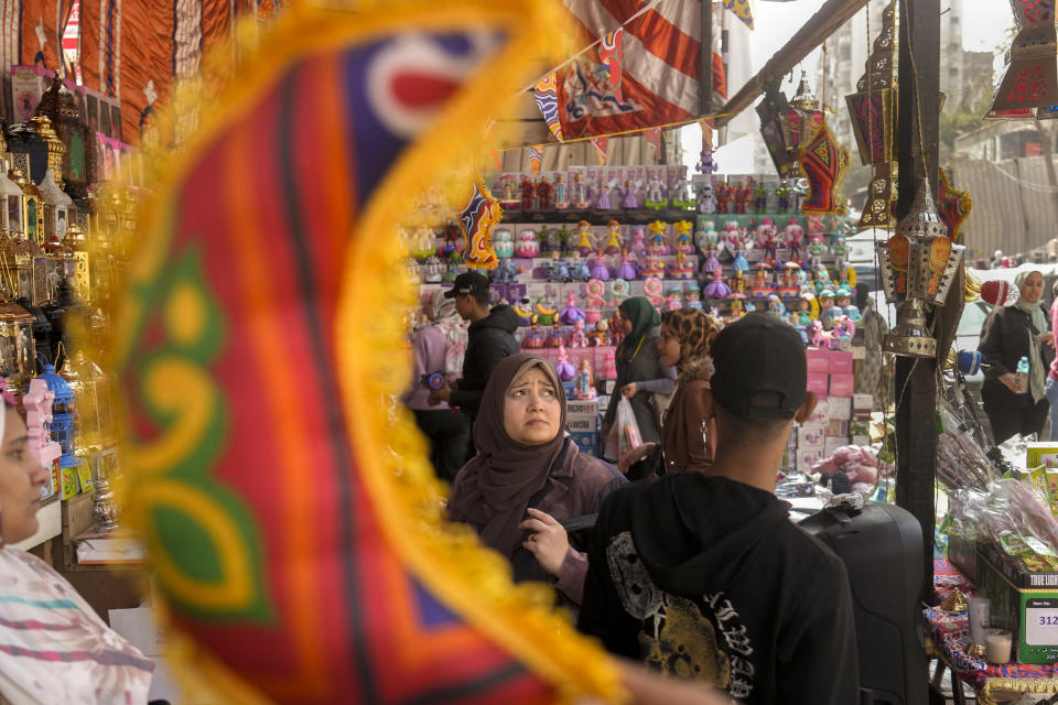 People buy traditional lanterns and decorations in Sayyeda Zeinab market ahead of the upcoming Muslim fasting month of Ramadan, in Cairo, Egypt, Tuesday, March 21, 2023. (AP Photo/Amr Nabil)