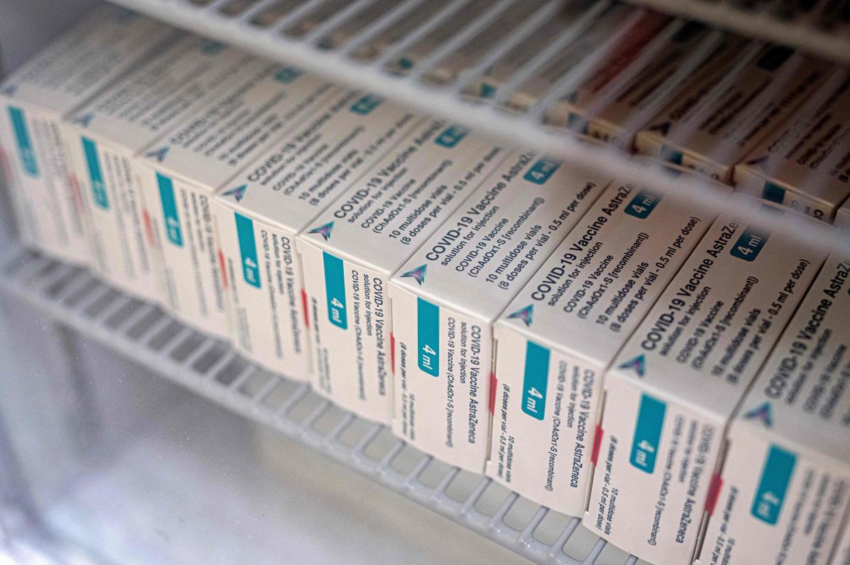 Packets of the AstraZeneca/Oxford Covid-19 vaccine, destined for housebound patients, are pictured in the fridge at Stubley Medical Centre near Chesterfield, central England on April 14, 2021. - Prime Minister Boris Johnson has said that the UK had passed 