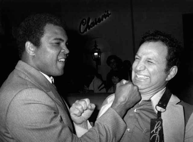 <p>Ron Galella Collection via Getty</p> A young Muhammad Ali and Ron Galella