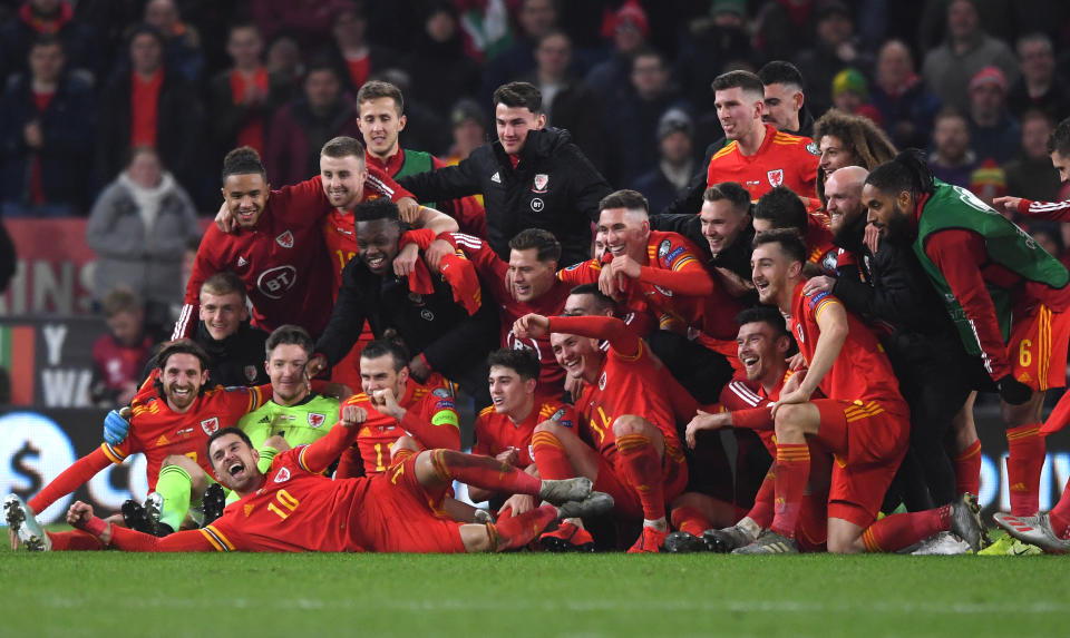 CARDIFF, WALES - NOVEMBER 19: Wales player Aaron Ramsey (front)  joins in the celebrations with his team mates after the UEFA Euro 2020 qualifier between Wales and Hungary  at Cardiff City Stadium on November 19, 2019 in Cardiff, Wales. (Photo by Stu Forster/Getty Images)