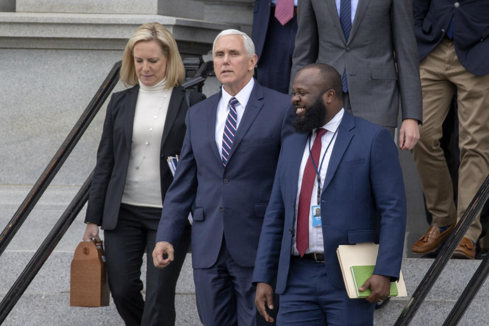 WASHINGTON, DC - JANUARY 05: (AFP OUT) (L-R)  Secretary of Homeland Security Kirstjen Nielsen, Vice President Mike Pence and Ja'Ron Smith special assistant to the President of the United States exit the Eisenhower Executive Office Building on January 05, 2019 in Washington, DC. The U.S government is going into the third week of a partial shutdown with Republicans and Democrats at odds on agreeing with President Donald Trump's demands for more money to build a wall along the U.S.-Mexico border. (Photo by Tasos Katopodis/Getty Images)