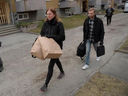 Police carry materials from a house search as part of the investigation after the terror attack in Drottninggatan where several people were killed and injured after a truck crashed into a department store Ahlens, in an apartment in Varberg south west of Stockholm, Sweden, April 8, 2017. Maja Suslin/TT News Agency via REUTERS