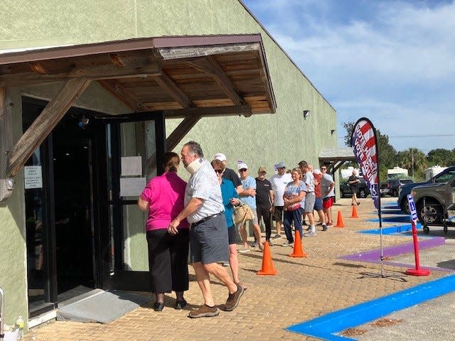 Voters wait their turn to enter and vote at the Moose Lodge on Merritt Island between 1 and 2 p.m. on Election Day 2022.
