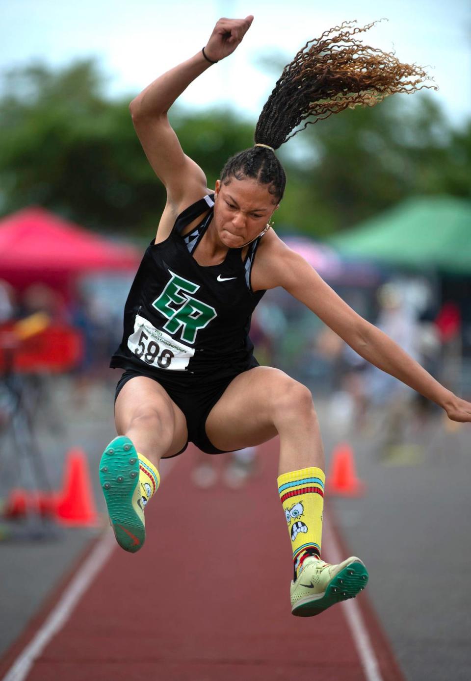 Emerald Ridge’s JaiCieonna Gero-Holt jumps to a second-place finish in the 4A girls long jump - the only event she didn’t win over the weekend - during the final day of the WIAA state track and field championships at Mount Tahoma High School in Tacoma, Washington, on Friday, May 26, 2023.