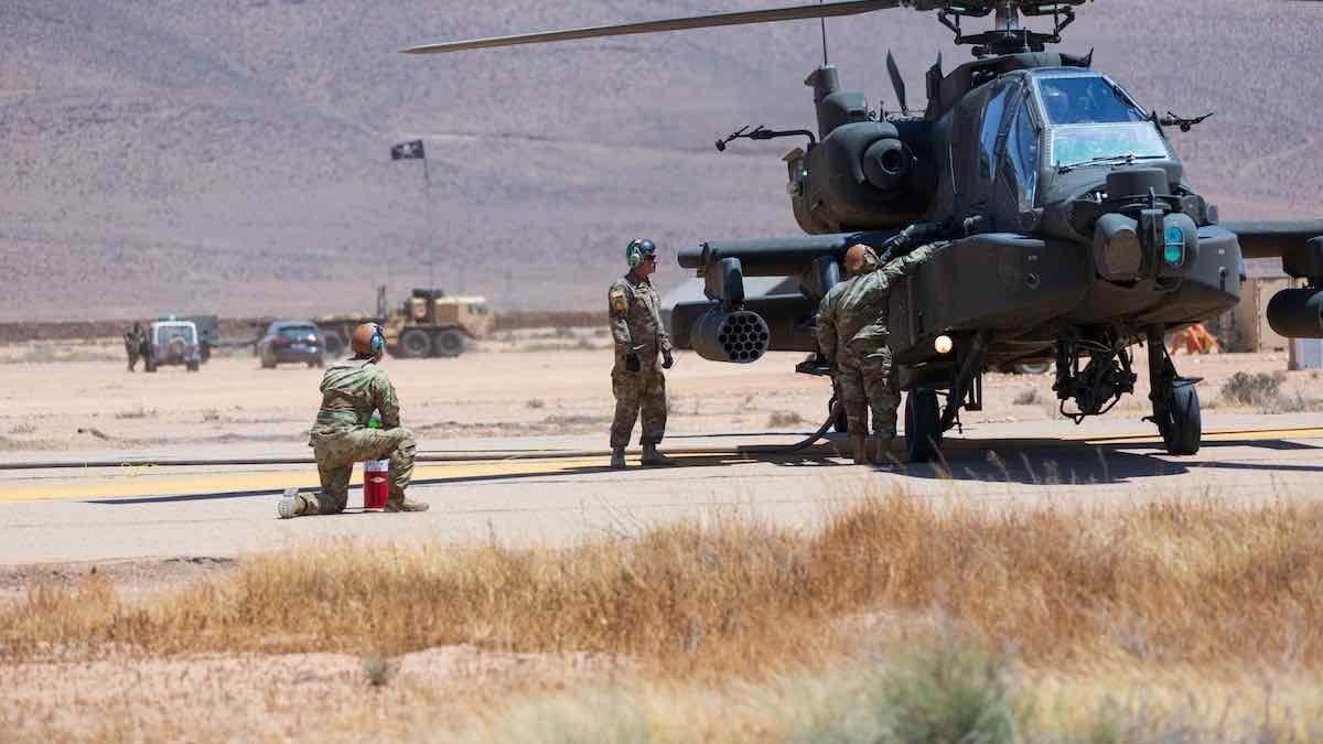 utah national guard soldiers of the 1st attack reconnaissance battalion, 211th aviation regiment, utah army national guard fuel an ah 64d apache helicopter in guelmim, morocco, june 27, 2022, as part of exercise african lion the 2022 training exercise marks the first time apache helicopters have flown, supported, and fired rounds in morocco african lion 2022 is us africa command's largest, premier, joint, annual exercise hosted by morocco, ghana, senegal and tunisia, june 6 30 more than 7,500 participants from 28 nations and nato train together with a focus on enhancing readiness for us and partner nation forces al22 is a joint all domain, multi component, and multinational exercise, employing a full array of mission capabilities with the goal to strengthen interoperability among participants and set the theater for strategic access