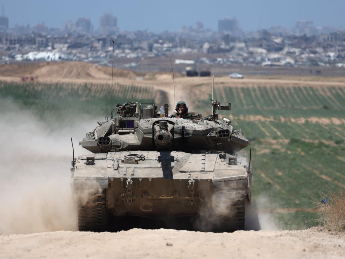 Israeli tanks patrol near the security fence with Jabalia in the northern part of the Gaza Strip (EPA)