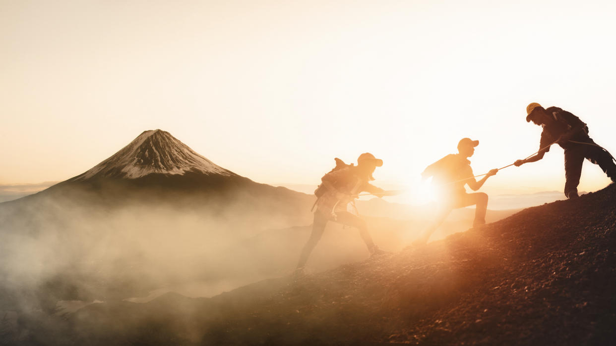  Hikers with Mount Fuji in the distance. 