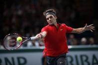 Switzerland's Roger Federer returns a shot during his men's singles tennis match against Lucas Pouille of France in the third round of the Paris Masters tennis tournament at the Bercy sports hall in Paris, October 30, 2014. REUTERS/Benoit Tessier