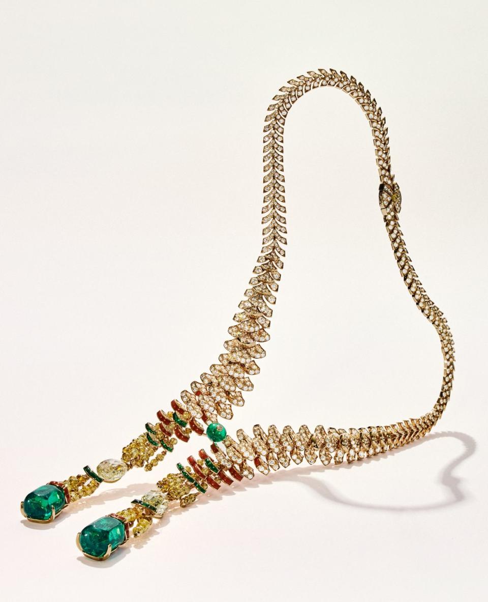 a gold necklace with beads