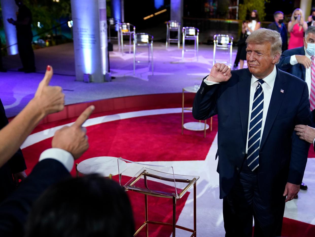 US president Donald Trump refused to denounce QAnon at NBC Town Hall on Thursday  (AP)