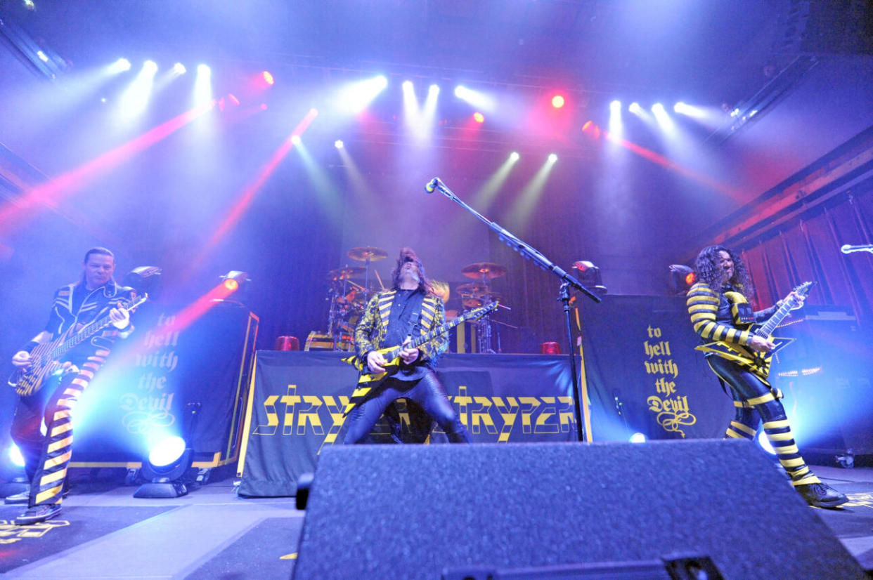 Stryper, in their signature colors, performing at Louisville, Kentucky’s Mercury Ballroom in November 2016. (Photo credit: Stephen J. Cohen/Getty Images)