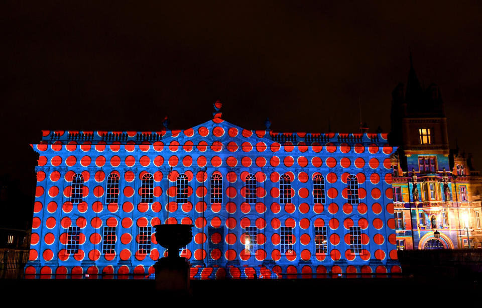 <p>Senate House and Gonville and Caius College are lit up with projections during the e-Luminate Cambridge Festival, where the city’s most iconic buildings are bathed in multi-coloured light bringing together art, science and technology. (PA) </p>