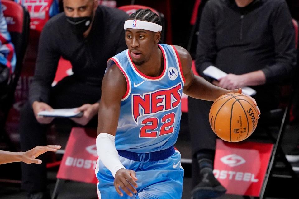 Brooklyn Nets guard Caris LeVert (22) looks for his next move during the first quarter of an NBA basketball gam, Sunday, Jan. 10, 2021, in New York. (AP Photo/Kathy Willens).