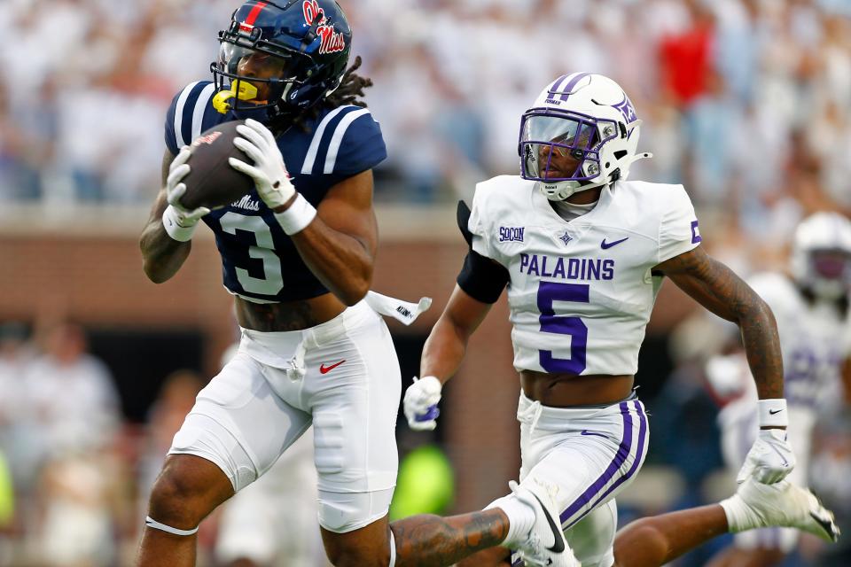 Aug 31, 2024; Oxford, Mississippi, USA; Mississippi Rebels wide receiver Antwane Wells Jr. (3) catches the ball against Furman Paladins defensive back Hysan Dalton (5) during the first half at Vaught-Hemingway Stadium. Mandatory Credit: Petre Thomas-USA TODAY Sports