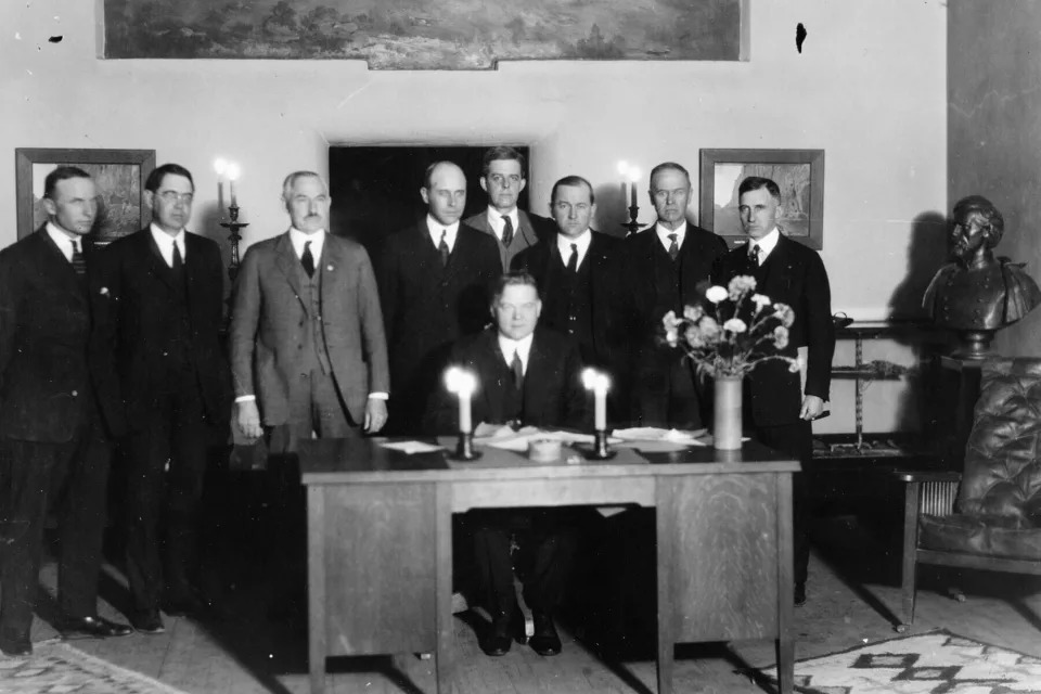 In this photo provided by the U.S. Bureau of Reclamation, Commerce Secretary Herbert Hoover presides over the signing of the Colorado River Compact in Santa Fe, N.M., on Nov. 24, 1922. Seven land-owning white men brokered a deal to allocate water from the Colorado River, which winds through the West and ends in Mexico. (U.S. Bureau of Reclamation via AP)