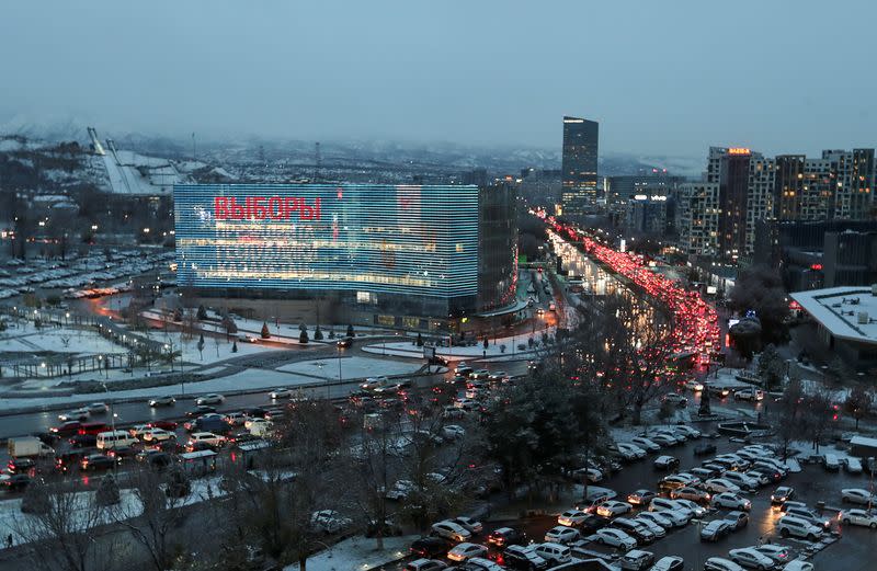 An electronic screen, installed on the facade of a business centre, displays information on the upcoming presidential election in Almaty