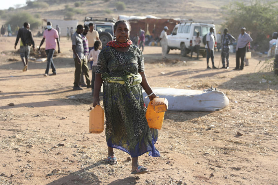 Ethiopian refugees gathert in Qadarif region, easter Sudan, Friday, Nov 20, 2020. Thousands of Ethiopians fled the war in Tigray region into Sudan. (AP Photo/Marwan Ali)