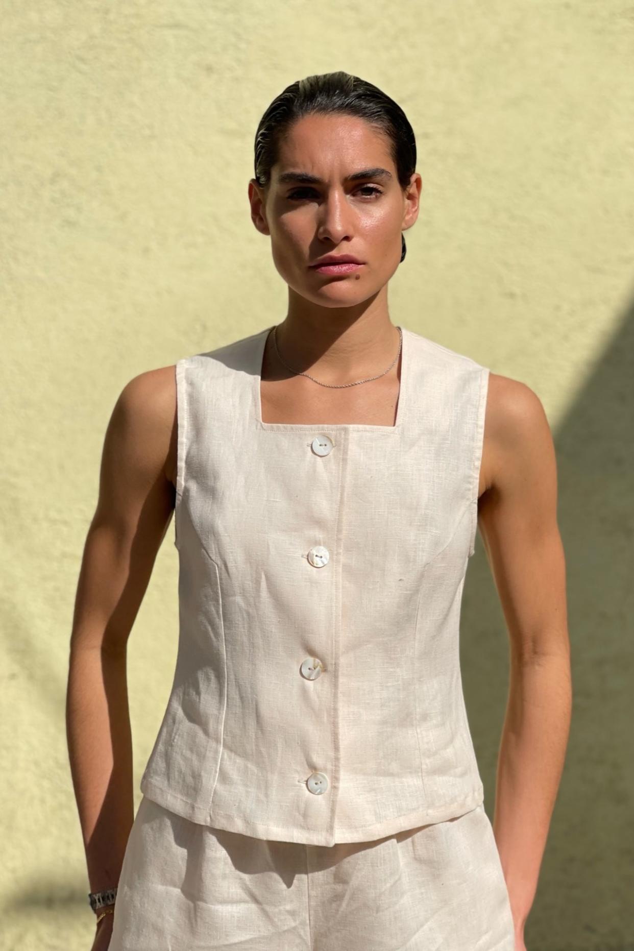 <p><a href="https://chavastudio.com/collections/made-to-order-clothing/products/linen-square-neck-vest-in-rose-white" rel="nofollow noopener" target="_blank" data-ylk="slk:Shop Now;elm:context_link;itc:0;sec:content-canvas" class="link rapid-noclick-resp">Shop Now</a></p><p>Linen Square Neck Vest</p><p>$330.00</p><p>chavastudio.com</p><span class="copyright">Chava Studio</span>