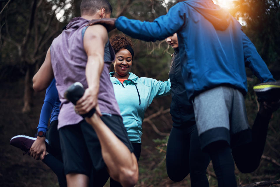 Cropped shot of a sporty young group of friends working out in the forest. (Getty Images)
