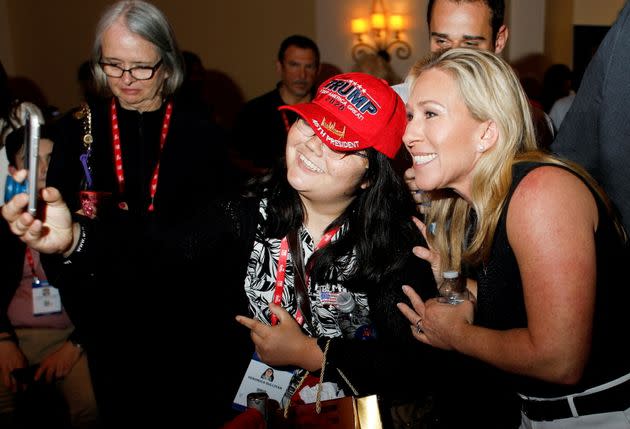 Rep. Marjorie Taylor Greene (R-Ga.) poses for a picture with a Donald Trump supporter at the Conservative Political Action Conference (CPAC) in Orlando, Florida, on Friday. Greene later spoke at AFPAC. (Photo: Octavio Jones/Reuters)