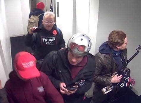 Paul E. Kovacik, wearing the Trump sweatshirt, seen inside the U.S. Capitol on Jan. 6, 2020.