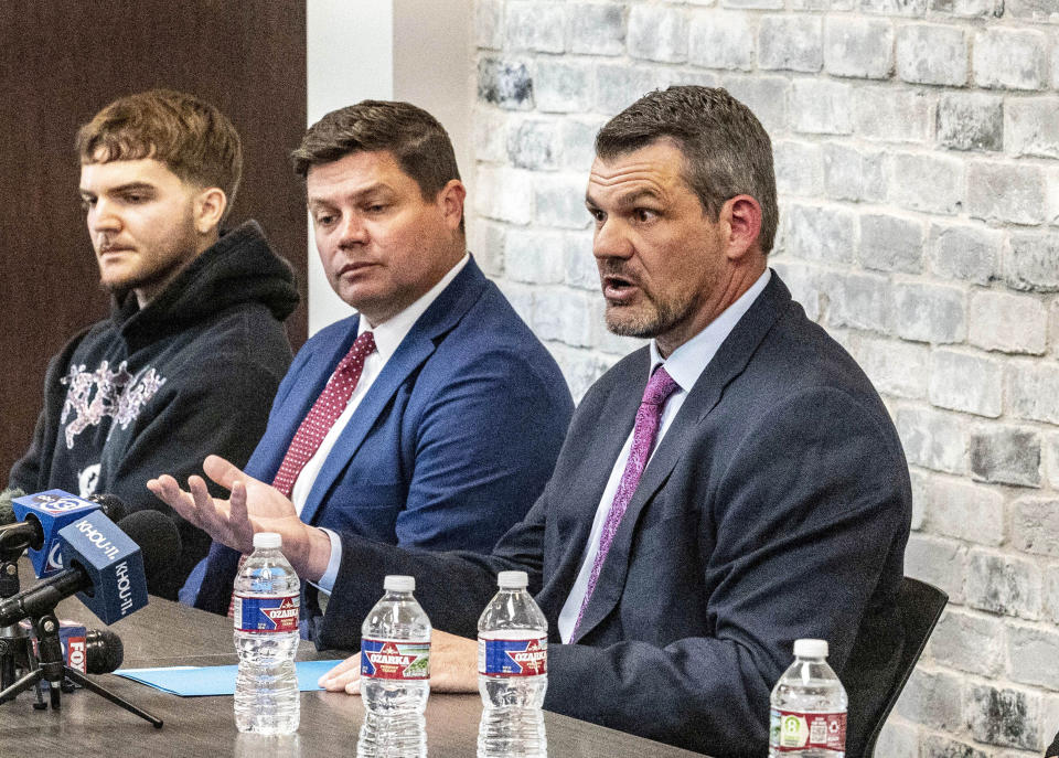 Attorney Tommy Hastings, right, speaks on behalf of his and fellow attorney Gabe Sassin's clients during a press conference, Wednesday, April 24, 2024 in The Woodland, Texas. Several relatives of patients who died while waiting for a new liver said Wednesday they want to know if their loved ones were wrongfully denied a transplant by Dr. Steve Bynon, a Houston doctor accused of manipulating the waitlist to make some patients ineligible to receive a new organ. (Kirk Sides/Houston Chronicle via AP)