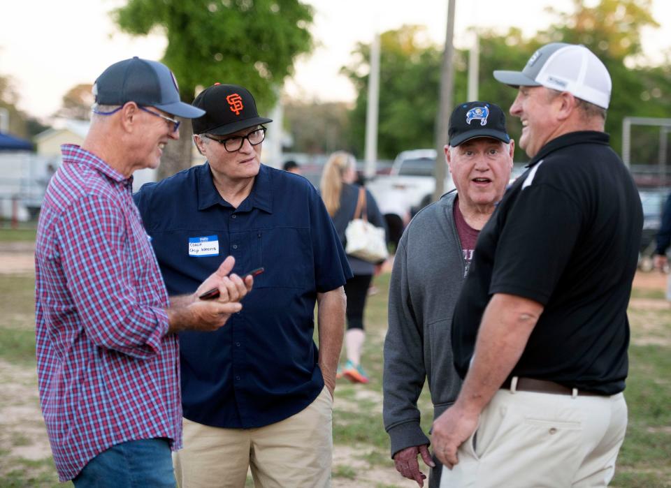 Former Woodham High School baseball coaches Andy Lashley, Chip Weems, Mack Sturdivant, and Jon Boddy relive the glory days of Woodham High baseball during West Florida High School's Alumn night game on Friday, April 12, 2024.