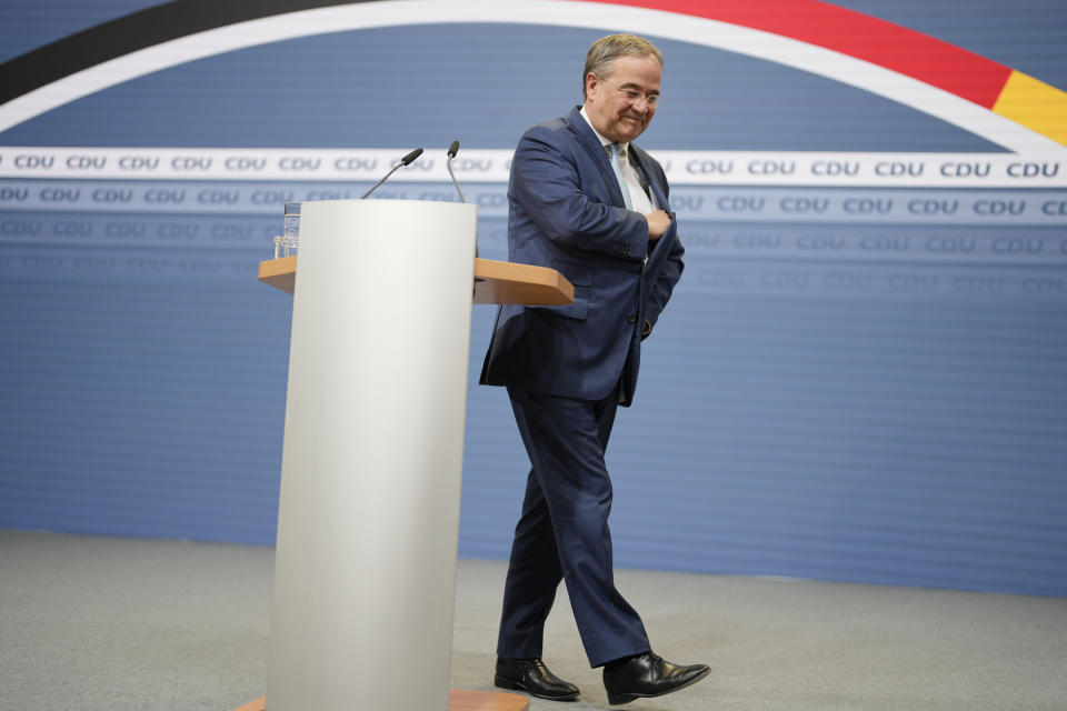 Christian Democratic Union party chairman Armin Laschet leaves the podium after he speaks to media at the party's headquarters in Berlin, Thursday, Oct. 7, 2021. (AP Photo/Markus Schreiber)