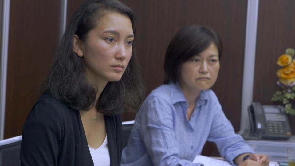 Shiori Ito, left, appears in a still from her documentary Black Box Diaries. 