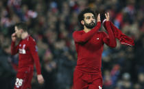 Liverpool forward Mohamed Salah, right, applauds after his team won the Champions League Group C soccer match between Liverpool and Napoli at Anfield stadium in Liverpool, England, Tuesday, Dec. 11, 2018.(AP Photo/Dave Thompson)