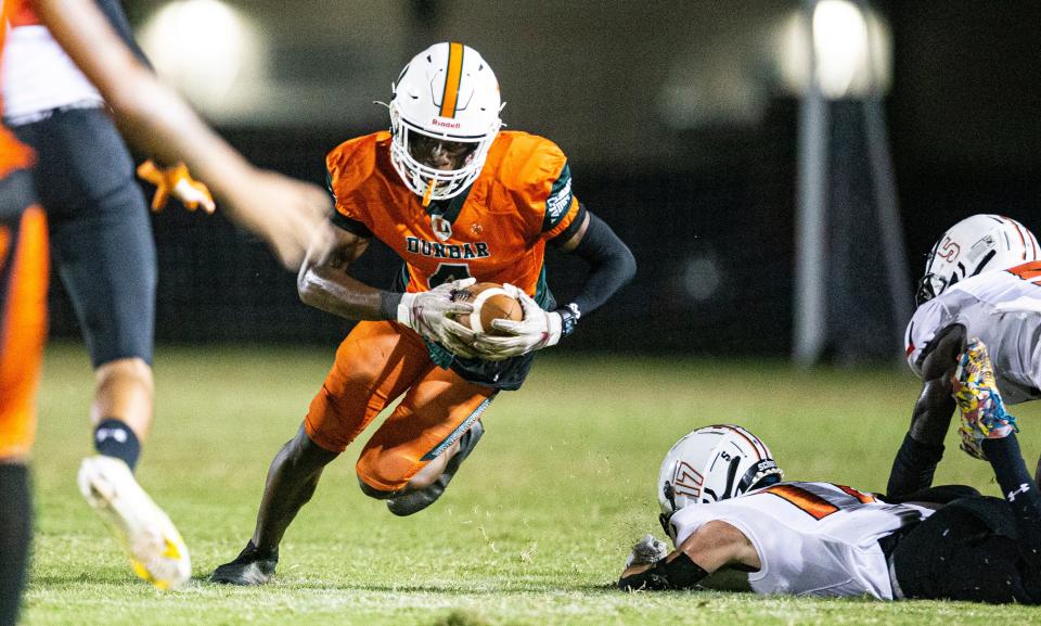 Dunbar’s Twaski Abrams runs for yards during a playoff game against Lely at Dunbar on Friday, Nov. 11, 2022. Dunbar won 21-7 and moves on.  