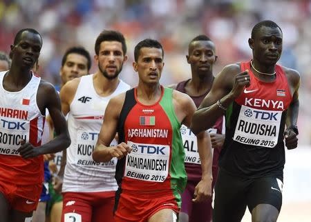 David Lekuta Rudisha of Kenya (R) leads in his heat of the men's 800 metres at the 15th IAAF World Championships at the National Stadium in Beijing, China August 22, 2015. REUTERS/Dylan Martinez