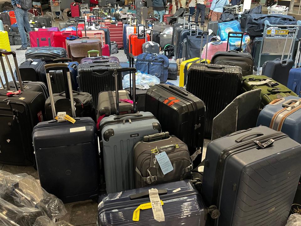 Unclaimed luggage piles up at London Heathrow Airport on July 8, 2022.