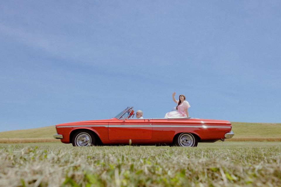 Anya Van Rose, a Canton-based alternative rock artist, is shown in a classic car during the filming of her music video for the new single, "Lucky Stars."