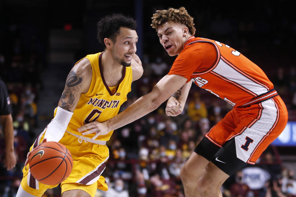 Minnesota guard Payton Willis (0) works around Illinois forward Coleman Hawkins (33) during the first half of an NCAA college basketball game Tuesday, Jan. 4, 2022, in Minneapolis. (AP Photo/Bruce Kluckhohn)