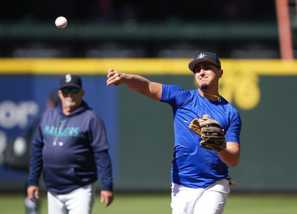 Seattle Mariners' Josh Rojas throws during batting practice before a baseball game against the Boston Red Sox, Tuesday, Aug. 1, 2023, in Seattle. (AP Photo/Lindsey Wasson)