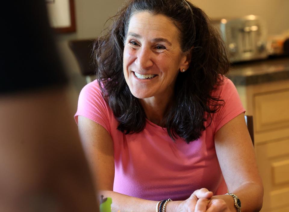 Dr. Bonnie Feola talks with the Gill family at her home in Salt Lake City on Wednesday, July 26, 2023. Feola works with kids and parents on learning about eating healthy and how to prepare food. | Scott G Winterton, Deseret News