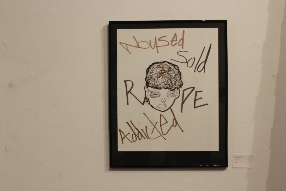 This painting by a young artist expresses their reality at the exhibit.