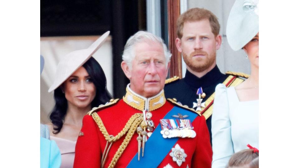 Prince Harry and Meghan Markle with King Charles on balcony