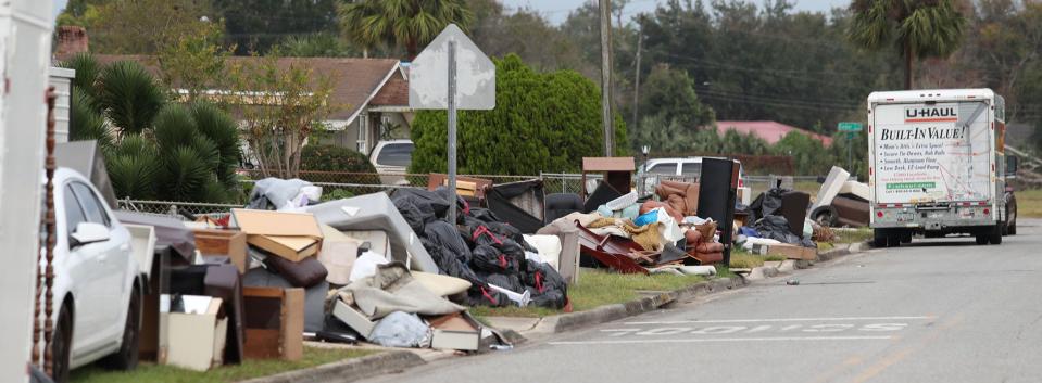 Flood-damaged home furnishings still lined Willie Drive a month after Tropical Storm Ian blasted through Daytona Beach last fall.