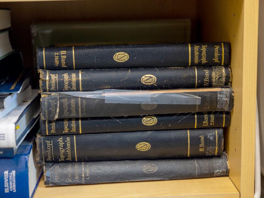 Stacks of books on a shelf in an office