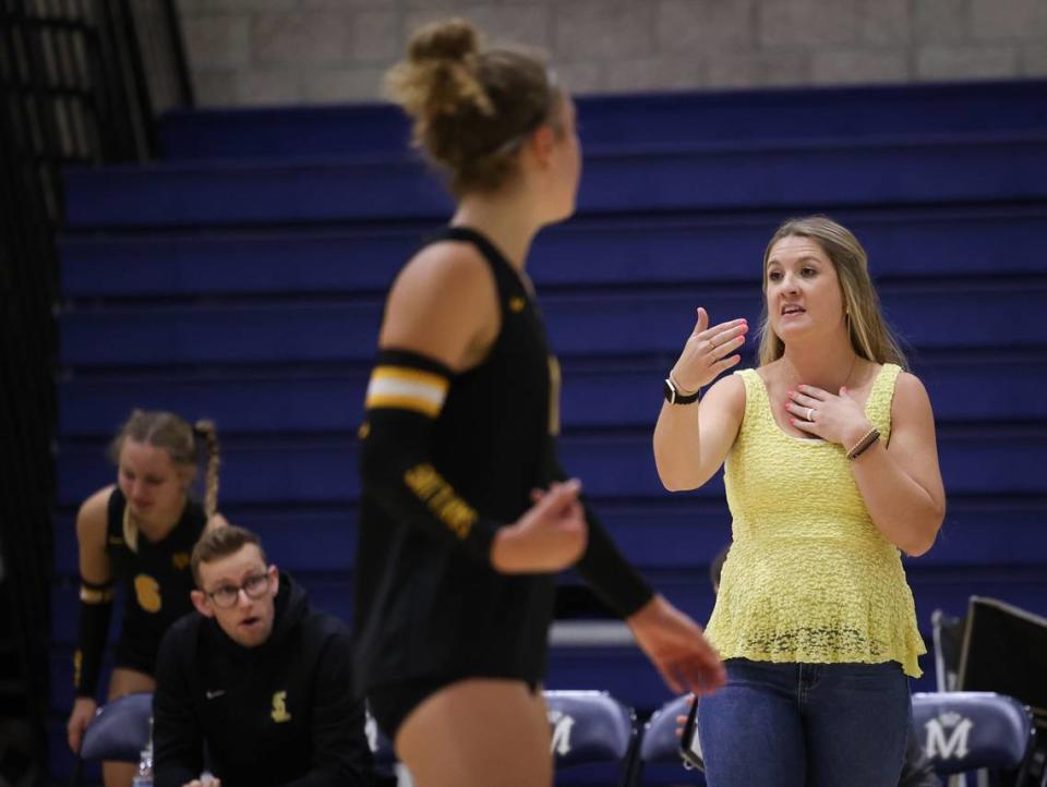 San Luis Obispo Head Coach Kennedy Meaney directs her players from the sideline of Cowitz Gymnasium as the San Luis Obispo Tigers girls volleyball team beat the Mission Prep Royals 3-0 Sept. 26, 2023.